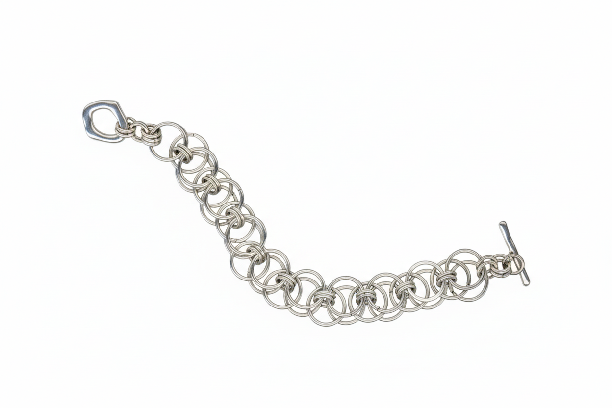Silver chain bracelet on a black background