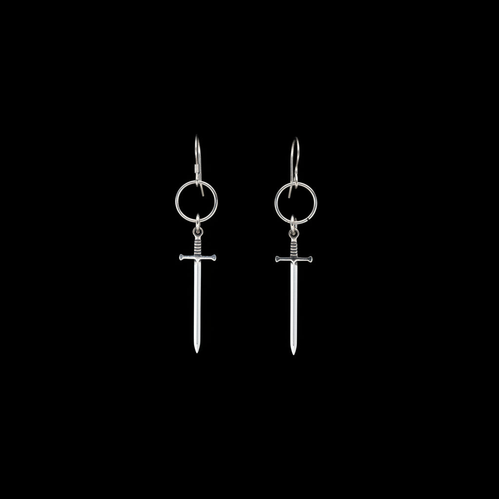 Silver sword-shaped earrings on a black background