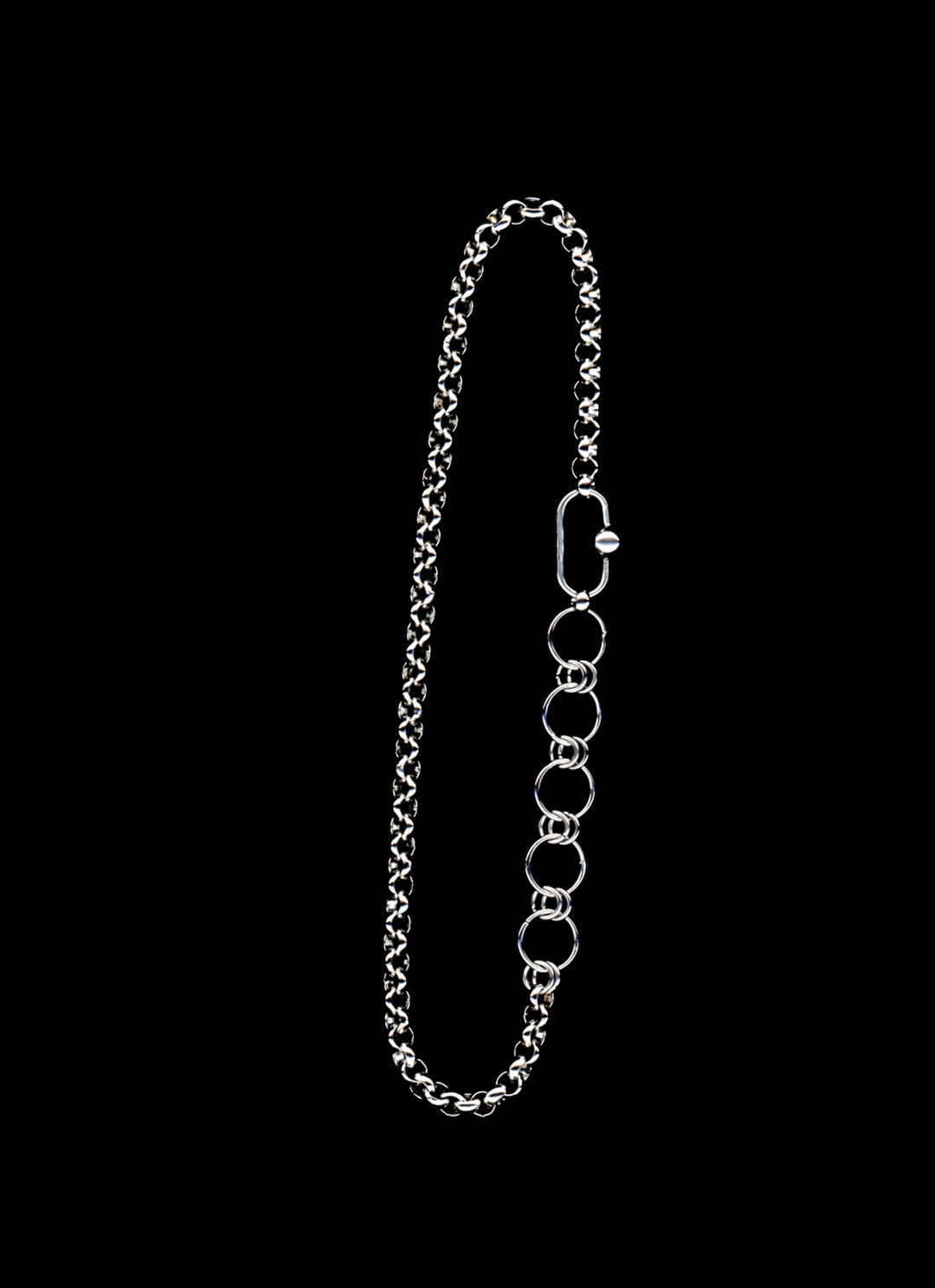 Stainless steel chain necklace with orbit carabiner and chainmail detail on a black background