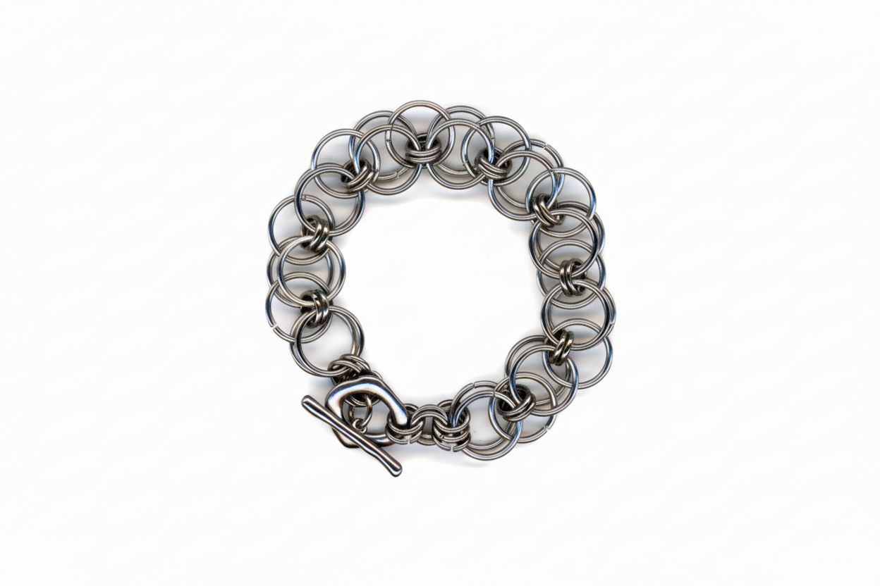 Silver chainmail bracelet on a white background