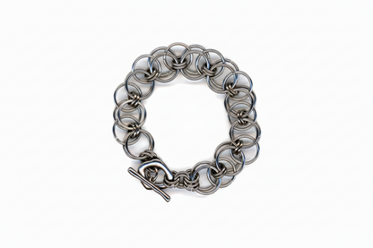 Silver chainmail bracelet on a white background