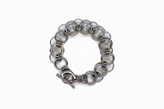 Silver chainmail bracelet on a white background