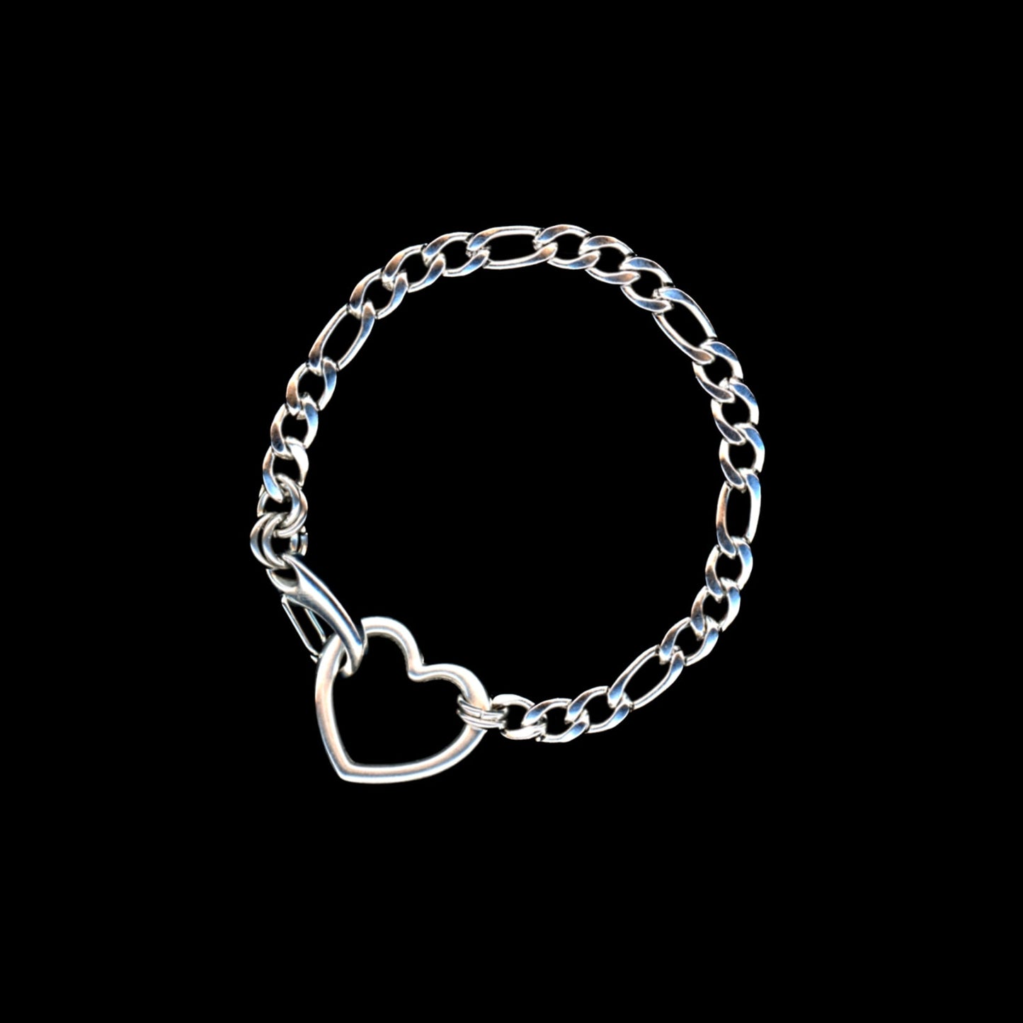 Silver chain bracelet with a heart charm on a black background