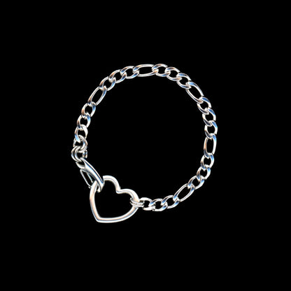 Silver chain bracelet with a heart charm on a black background