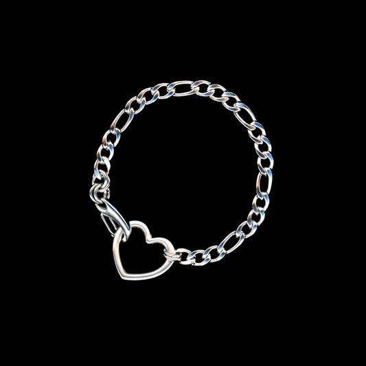 Silver chain bracelet with a heart charm on a black background