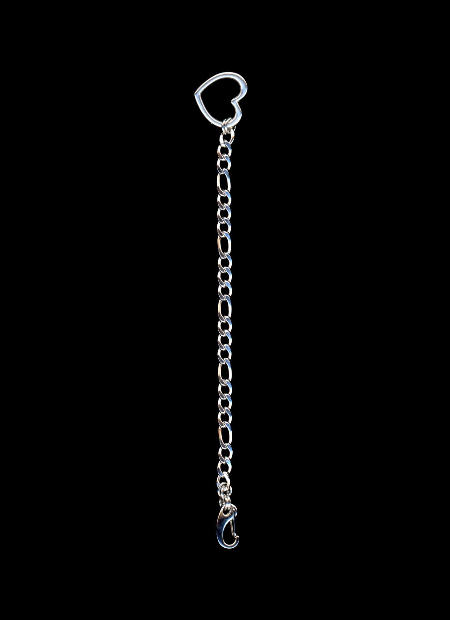 Silver chain with a heart-shaped clasp on a black background