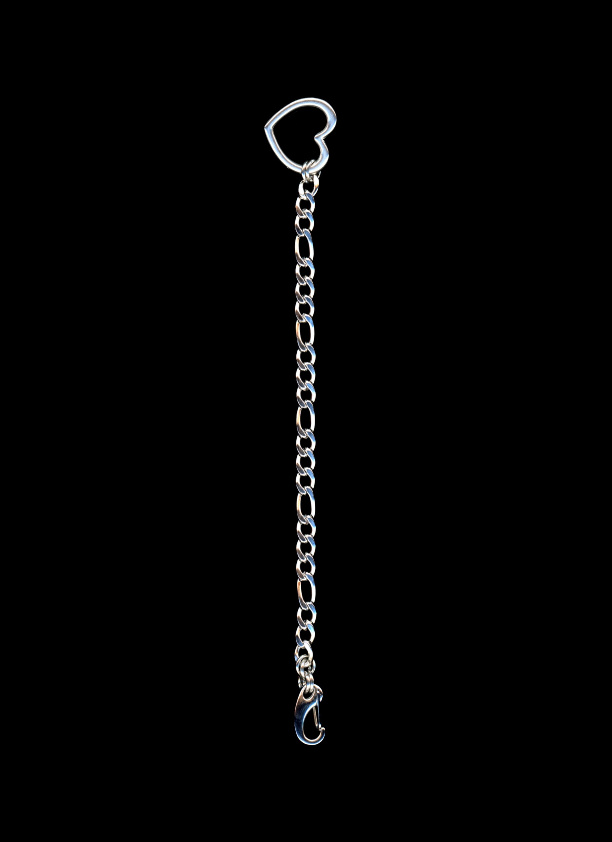 Silver chain with a heart-shaped clasp on a black background