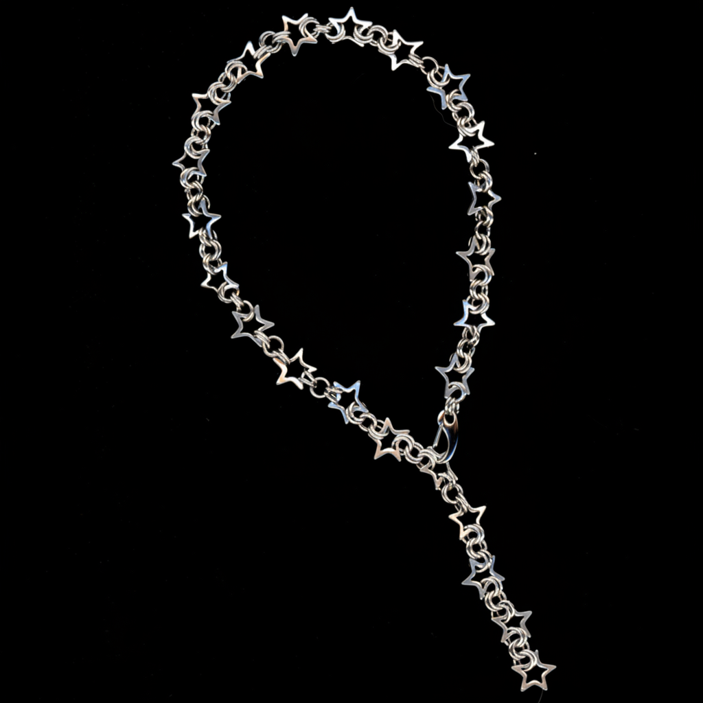 A stainless steel star chainmail necklace with a spring closure clasp, displayed against a black background.